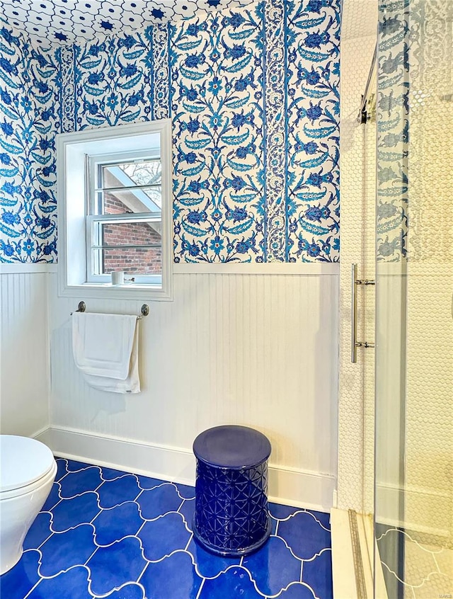 bathroom featuring tile patterned flooring and toilet