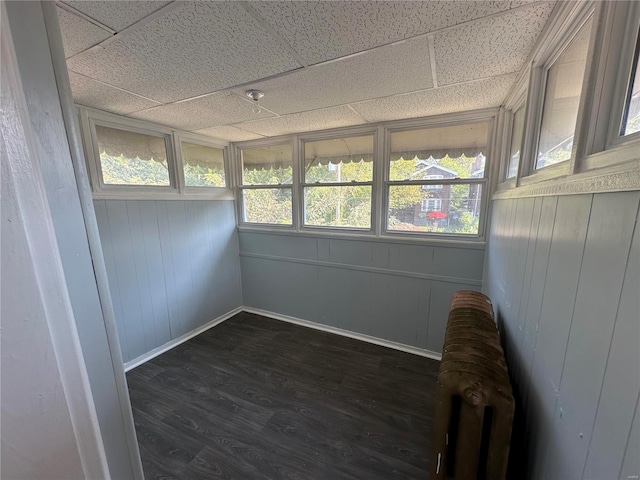 unfurnished sunroom with a paneled ceiling