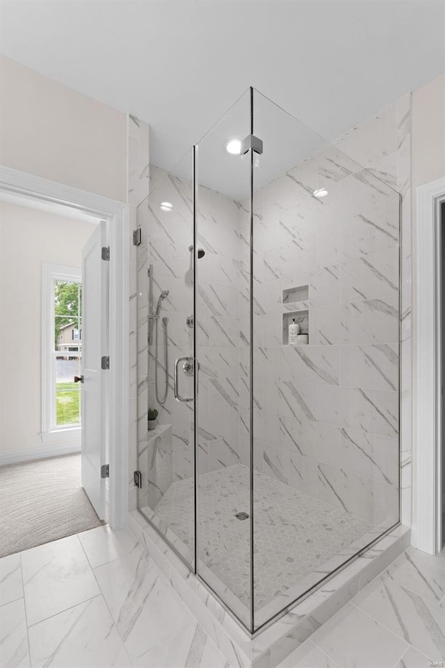 bathroom with a shower with shower door