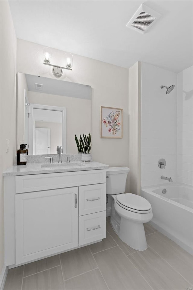 full bathroom with tile patterned floors, toilet,  shower combination, and vanity