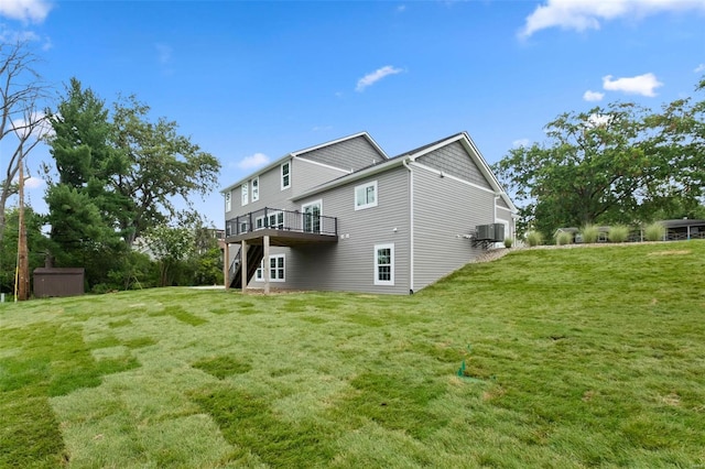 exterior space with a wooden deck, a lawn, a shed, and central AC unit