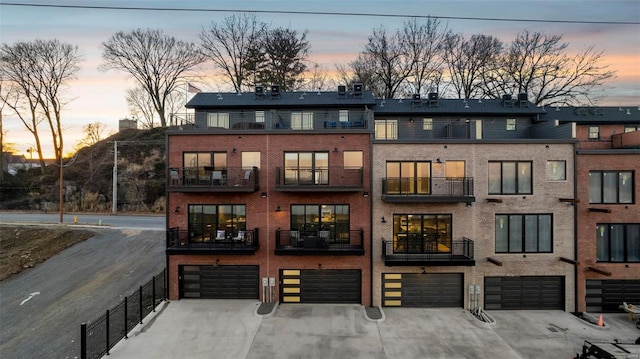 outdoor building at dusk with a garage