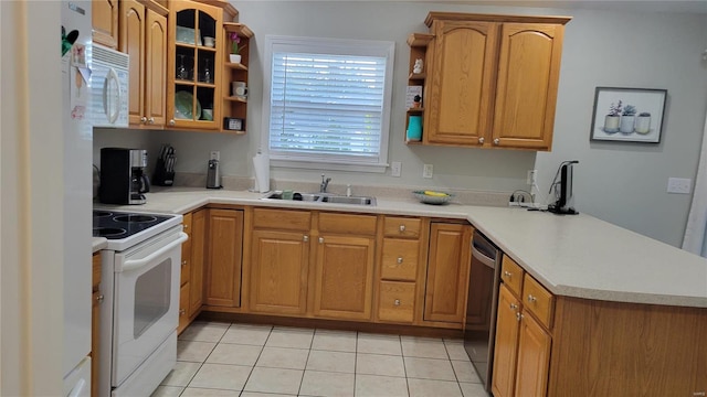 kitchen with white appliances, light tile patterned floors, plenty of natural light, and kitchen peninsula