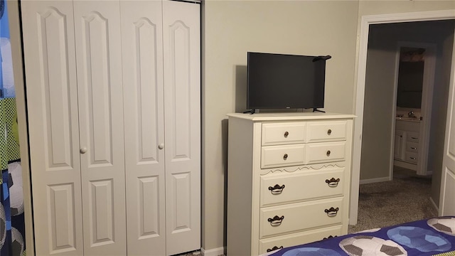 bedroom with dark colored carpet