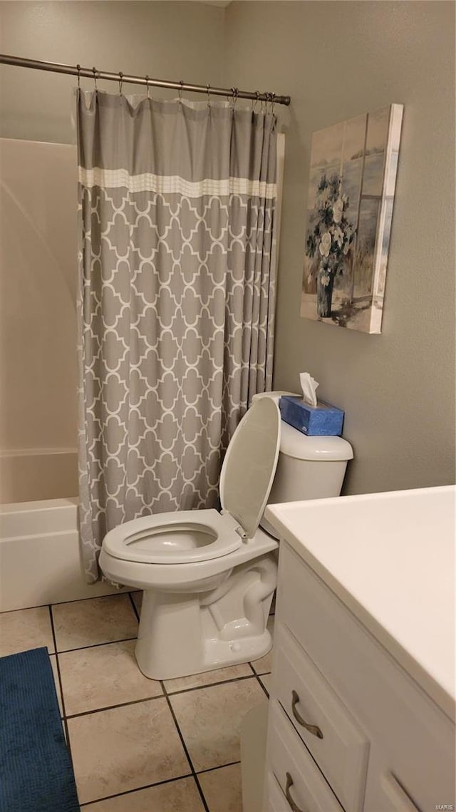 full bathroom featuring tile patterned flooring, toilet, shower / tub combo, and vanity