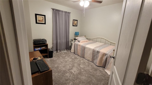 bedroom featuring ceiling fan and light carpet