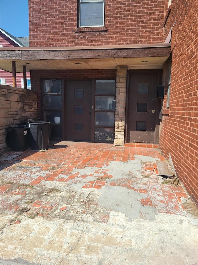 property entrance featuring a patio