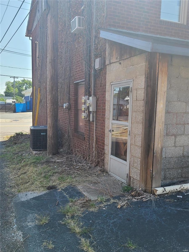 view of side of property featuring central AC unit