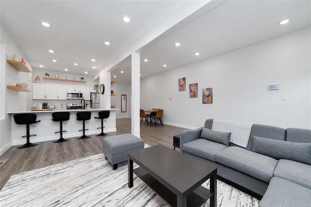 living room with light hardwood / wood-style flooring