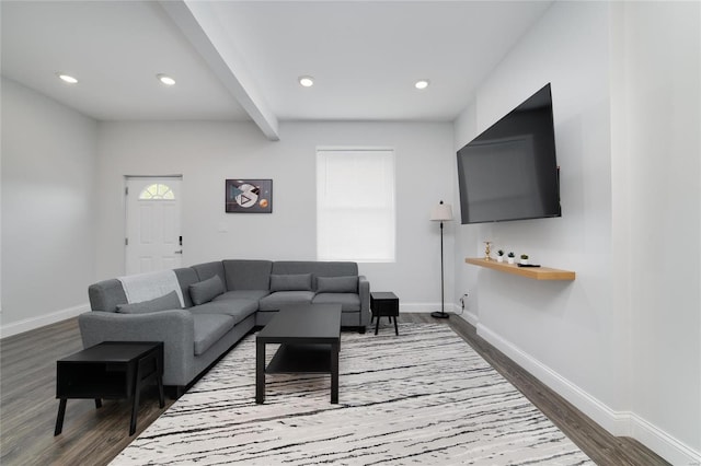 living room with beamed ceiling and dark hardwood / wood-style floors