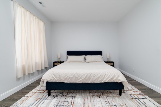 bedroom with hardwood / wood-style floors