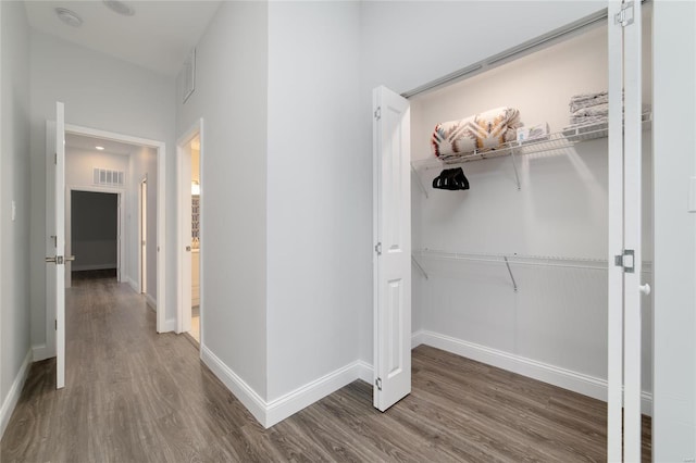 hallway featuring wood-type flooring