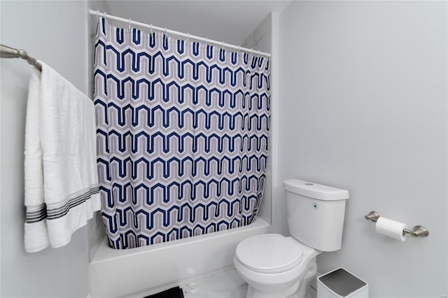 bathroom featuring toilet and shower / bath combo with shower curtain