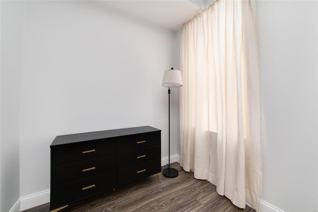 bedroom featuring dark hardwood / wood-style flooring