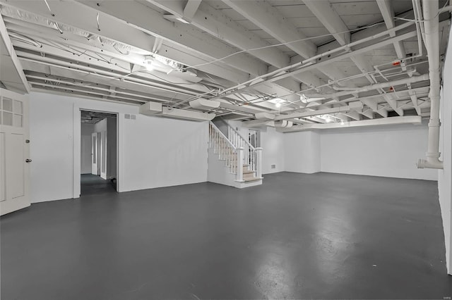 finished basement featuring stairway