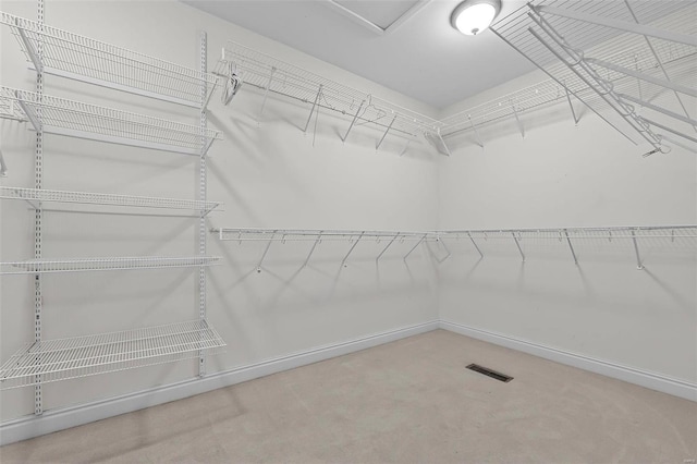 walk in closet with visible vents