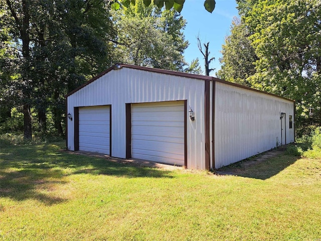 garage featuring a lawn