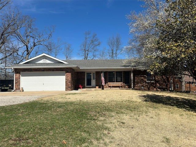 ranch-style home with a garage and a front yard