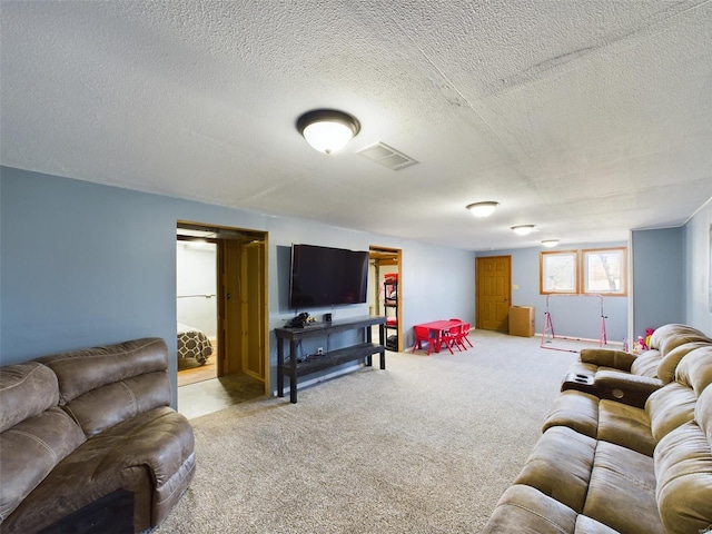 living room featuring a textured ceiling and carpet