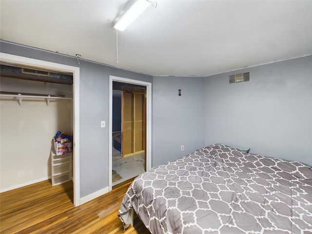 bedroom featuring a closet and hardwood / wood-style floors