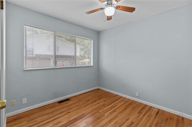 unfurnished room with ceiling fan and light wood-type flooring