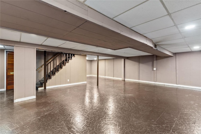 basement featuring a drop ceiling