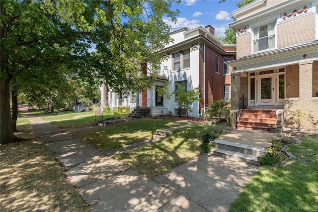 view of front of property featuring a porch and a front lawn