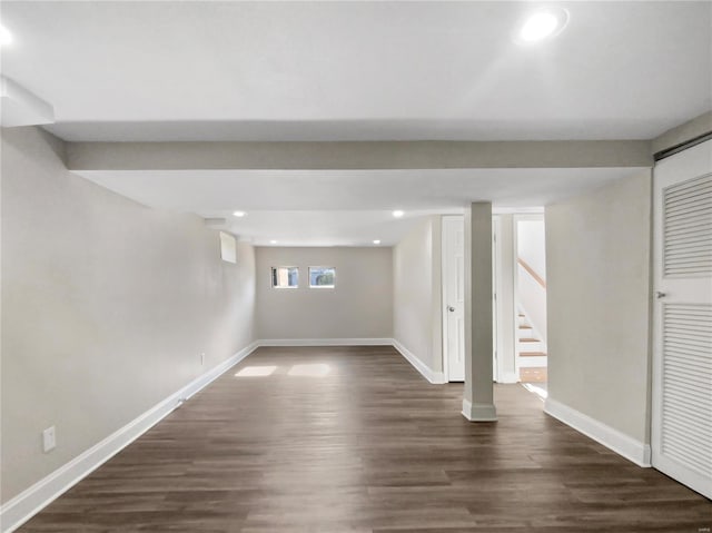 basement featuring dark hardwood / wood-style flooring