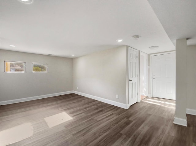 empty room featuring dark hardwood / wood-style flooring