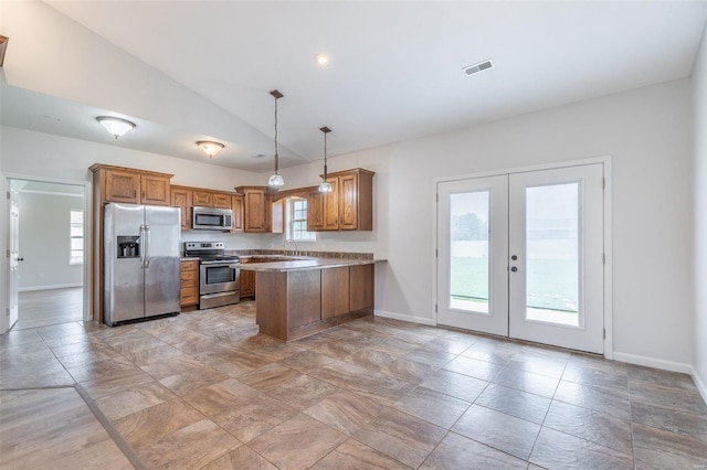 kitchen with vaulted ceiling, kitchen peninsula, appliances with stainless steel finishes, decorative light fixtures, and french doors