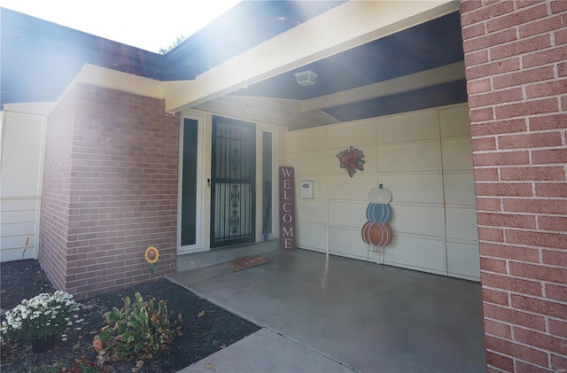 doorway to property featuring a garage