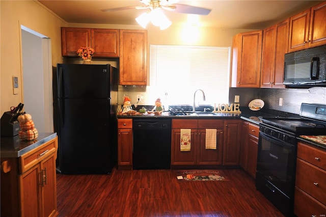 kitchen featuring dark wood-type flooring, black appliances, ceiling fan, and sink