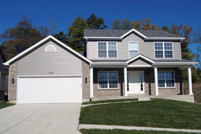 view of front of property with a front yard and covered porch