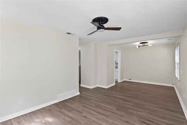 empty room featuring ceiling fan and hardwood / wood-style flooring