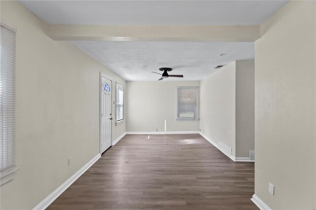 spare room featuring ceiling fan, dark hardwood / wood-style flooring, and a textured ceiling