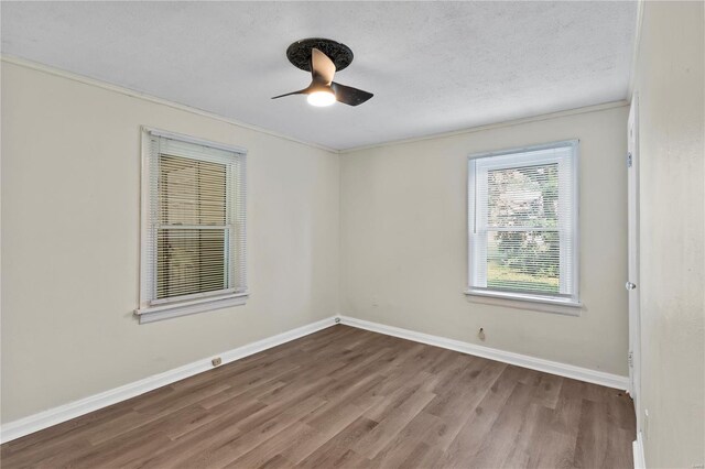 spare room featuring crown molding, a textured ceiling, hardwood / wood-style flooring, and ceiling fan