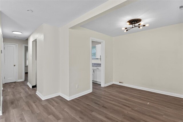 empty room with hardwood / wood-style floors