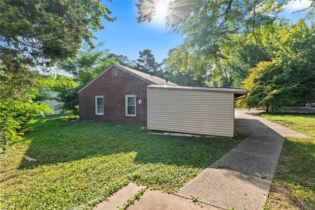 view of property exterior featuring a yard