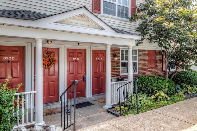 doorway to property with a porch