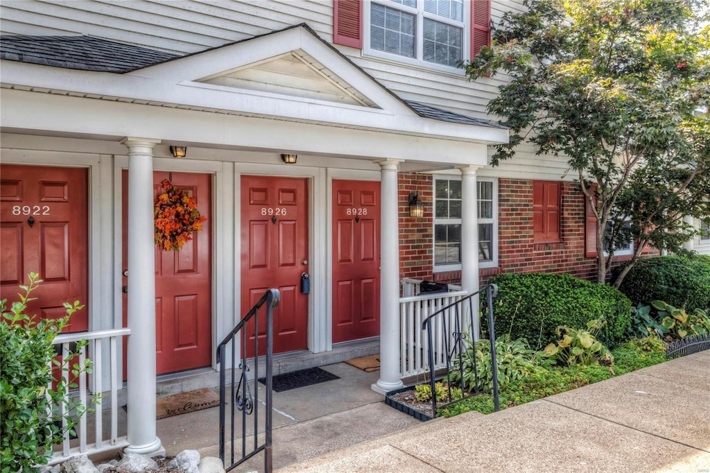 entrance to property with brick siding