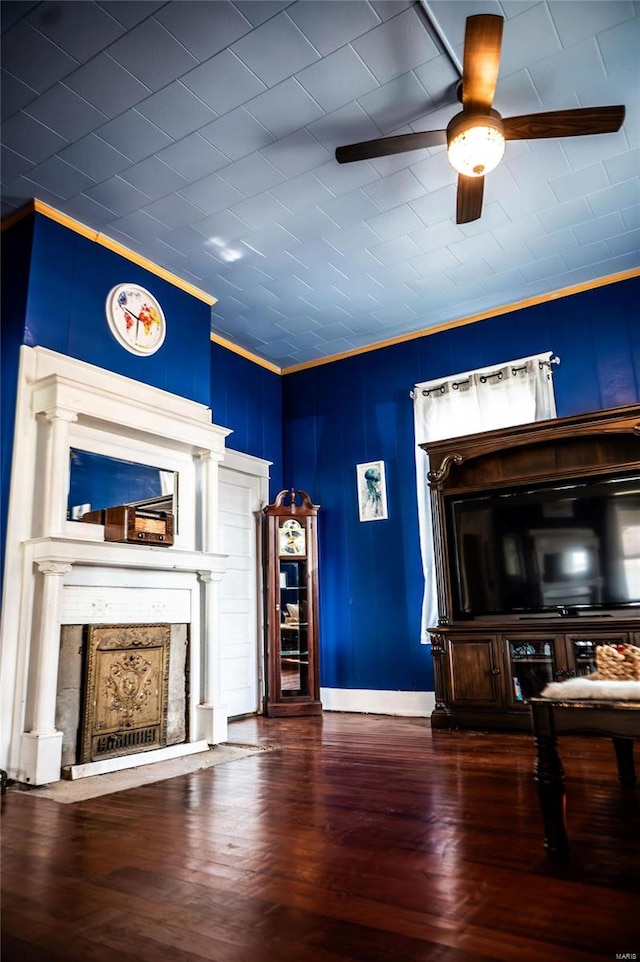 bar featuring crown molding, ceiling fan, and dark hardwood / wood-style flooring