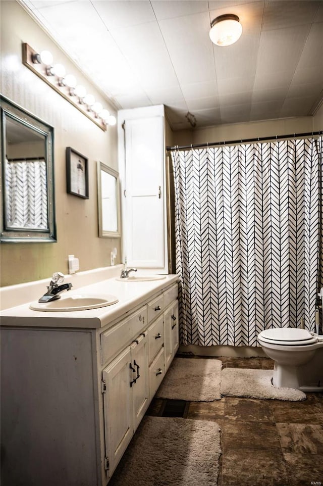 bathroom with a shower with shower curtain, toilet, and vanity