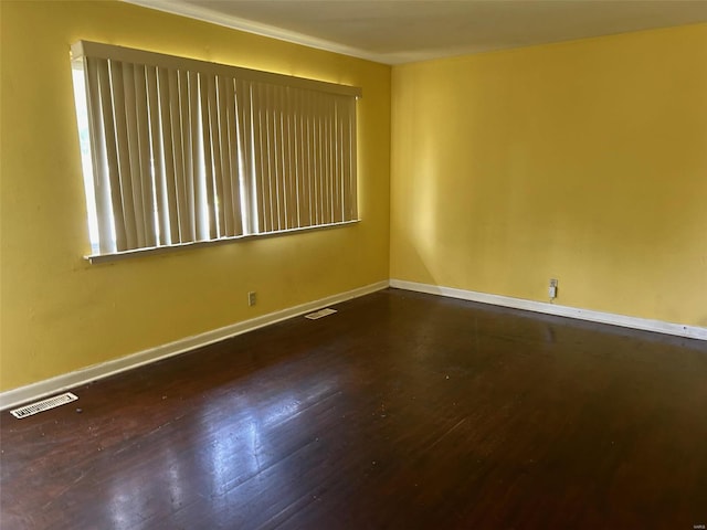 unfurnished room featuring dark wood-type flooring