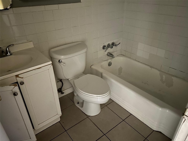 full bathroom featuring tile patterned floors, tile walls, toilet, and vanity