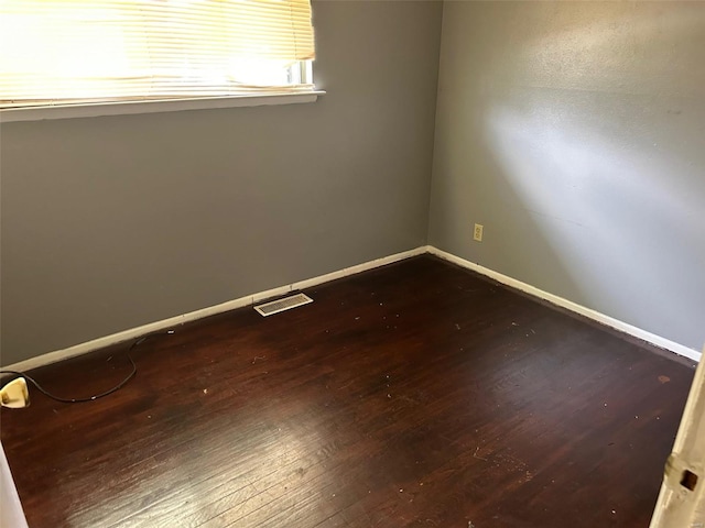 unfurnished room featuring hardwood / wood-style flooring