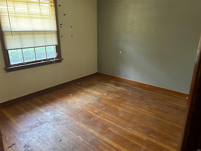 unfurnished room with dark hardwood / wood-style floors