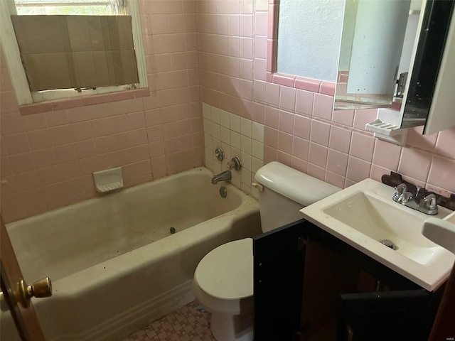 bathroom with toilet, vanity, tasteful backsplash, a washtub, and tile walls