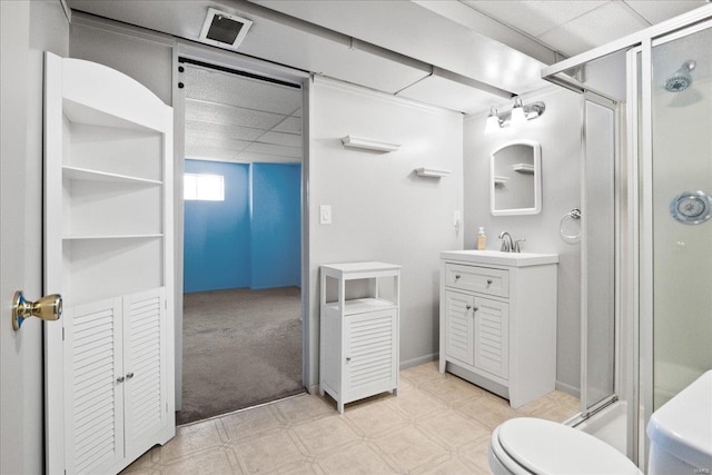 bathroom featuring visible vents, toilet, a stall shower, tile patterned floors, and vanity