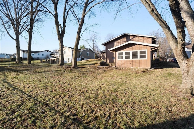 view of yard featuring a residential view and fence