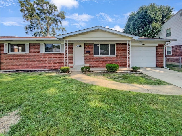 view of front of home featuring a garage and a front lawn